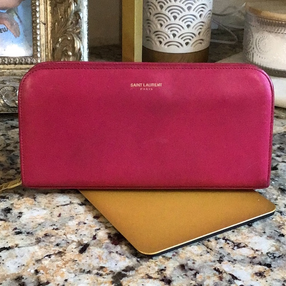 Saint Laurent. pink zippy lambskin wallet gold tone hardware